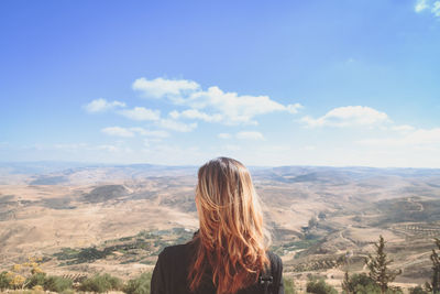 Scenic view of mountains against cloudy sky