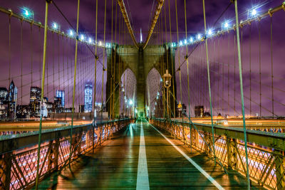 Illuminated brooklyn bridge at night