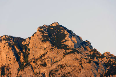 Low angle view of rock formations against clear sky