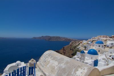 Panoramic view of sea against clear blue sky