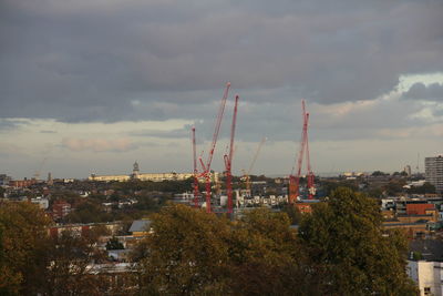 Cityscape against cloudy sky