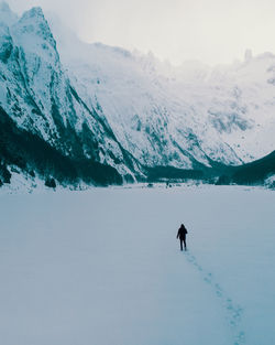 Aerial view of person walking on snowy landscape