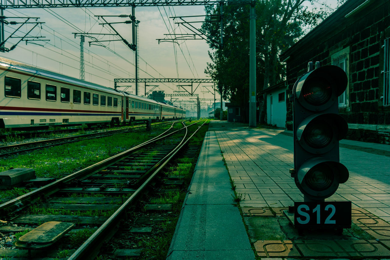 TRAIN ON RAILROAD STATION PLATFORM