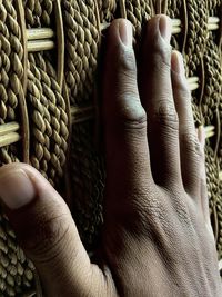 Close-up of man holding wicker basket