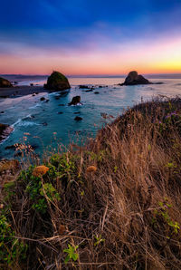 Scenic view of sea against sky during sunset