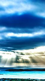 Scenic view of sea against storm clouds