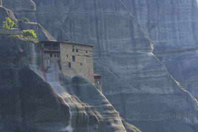 Scenic view of waterfall against mountain