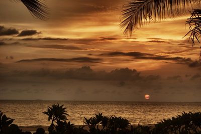 Scenic view of sea against sky at sunset