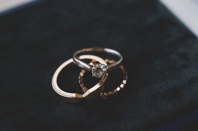 High angle view of wedding rings on table