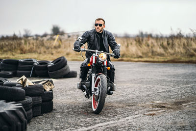 Man riding motorcycle on road