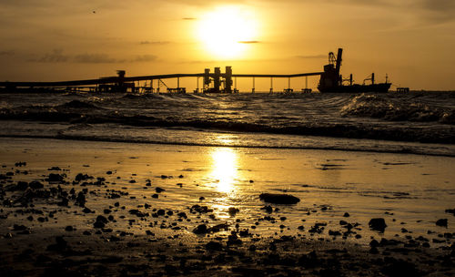 Scenic view of sea against sky at sunset