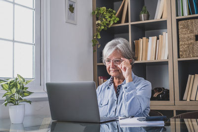Man sitting on table at home
