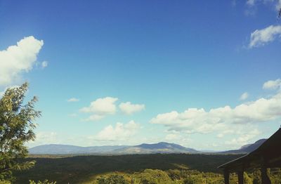 Scenic view of mountains against cloudy sky