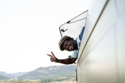 African american black man smiling in his green camper van