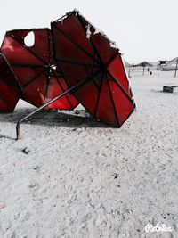 Red umbrella against sky