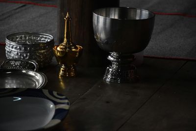 Close-up of wine glasses on table