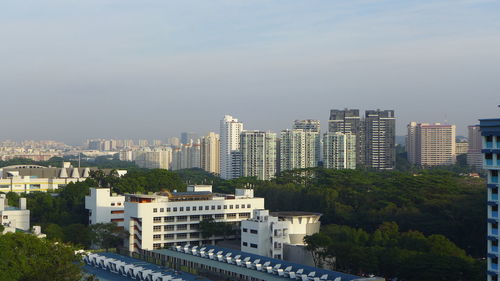 High angle view of buildings in city against sky