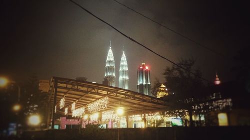 Low angle view of illuminated building at night