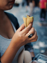 Close-up of woman holding ice cream