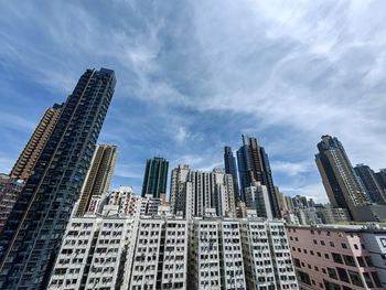 Modern buildings in city against sky