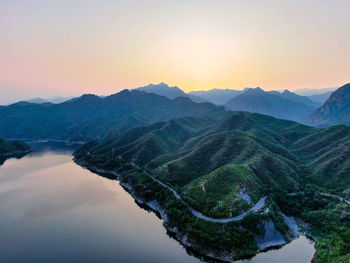 Scenic view of mountains against sky during sunset