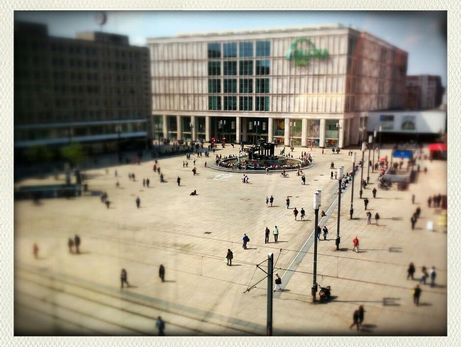 large group of people, transfer print, architecture, building exterior, built structure, city, city life, street, person, auto post production filter, crowd, mixed age range, walking, men, city street, lifestyles, high angle view, transportation, building