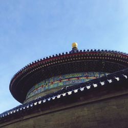 Low angle view of building against blue sky