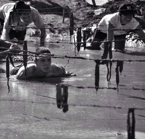 Soldiers undergoing training in mud