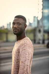 Portrait of young man standing outdoors