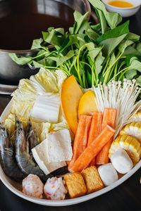 High angle view of vegetables in plate on table