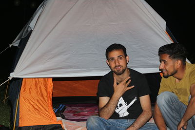 People sitting at tent