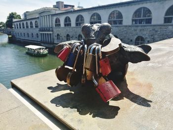 Sculpture of bridge over river in city