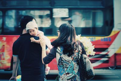 Woman standing in bus