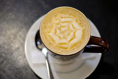 High angle view of cappuccino on table