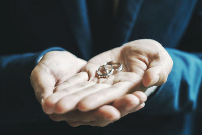 Close-up of man holding hands