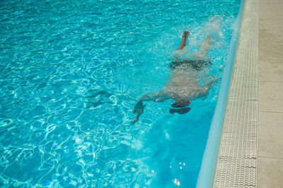 High angle view of man swimming in pool