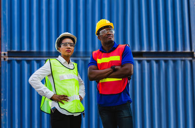 Man working with arms raised