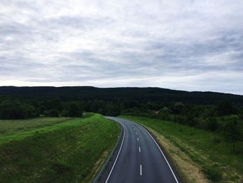 Country road passing through landscape