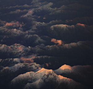 Low angle view of dramatic sky over mountain