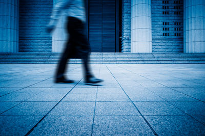 Shadow of people walking on street