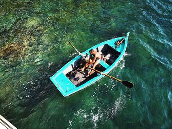 High angle view of people on boat in sea