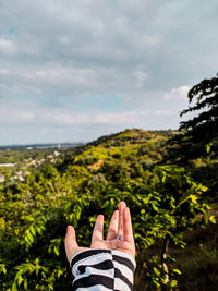 Low section of woman against sky