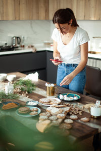 Woman preparing food on table