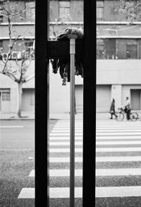 Close-up of window on road by building