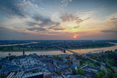 High angle view of buildings against sky during sunset