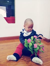 Close-up of cute baby girl at home