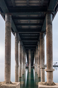 Low angle view of bridge over pier