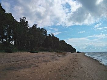 Scenic view of sea against cloudy sky