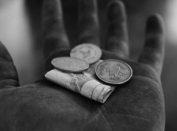 A worker's hand with some money