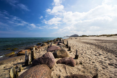 Scenic view of sea against cloudy sky